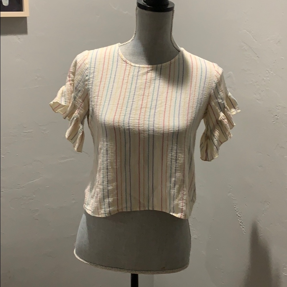 Rainbow lined top with embellished sleeves.